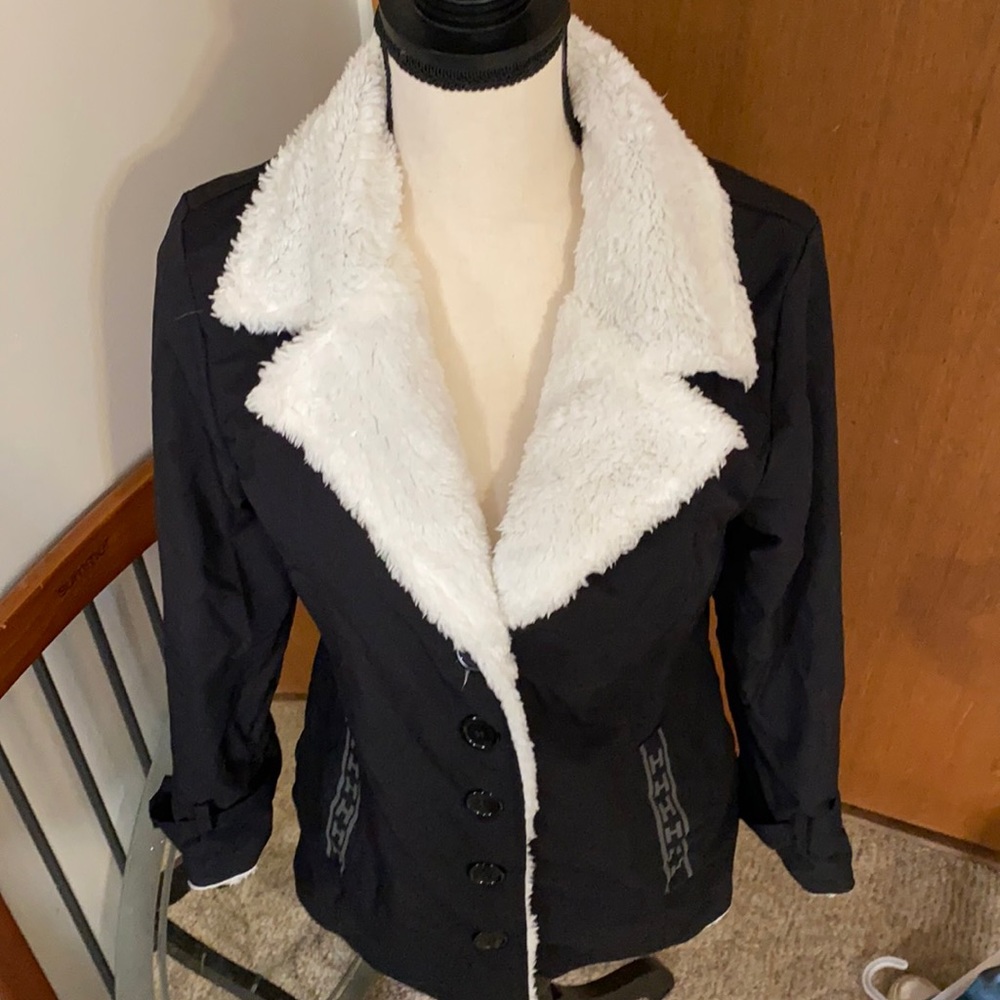 Faux shearling. Fits like a small.